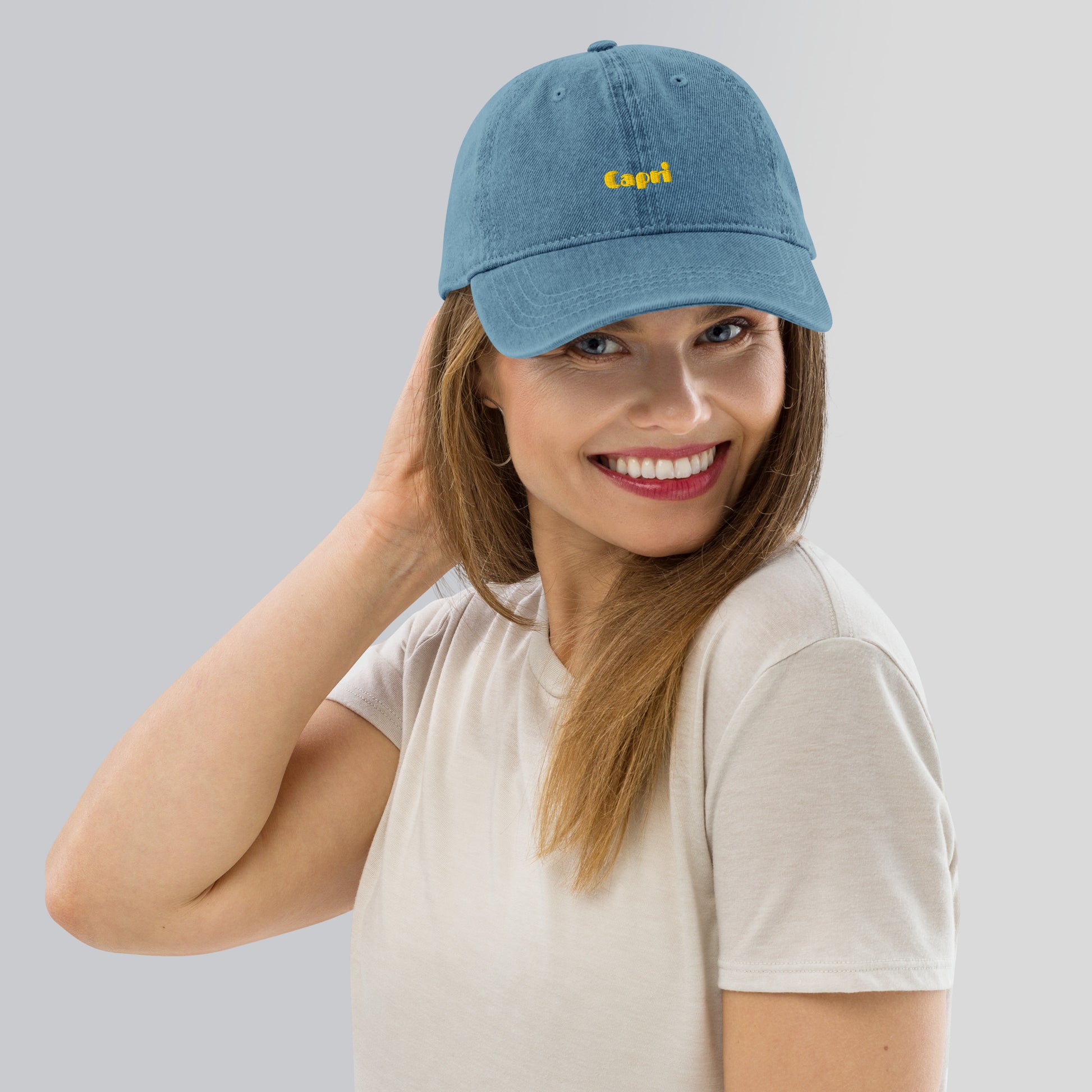 Capri denim cap with bold yellow lettering