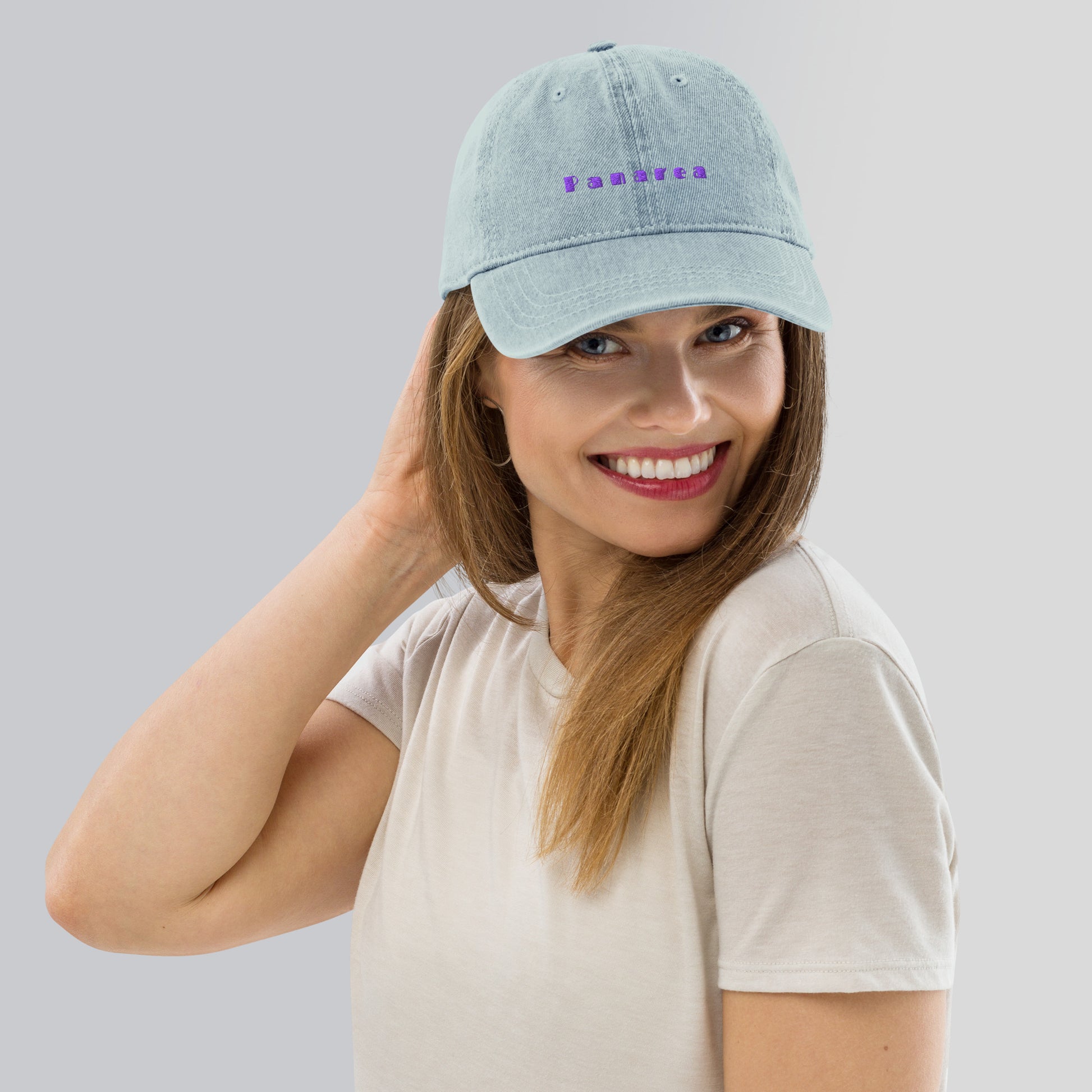 Panarea light denim cap with bold purple text