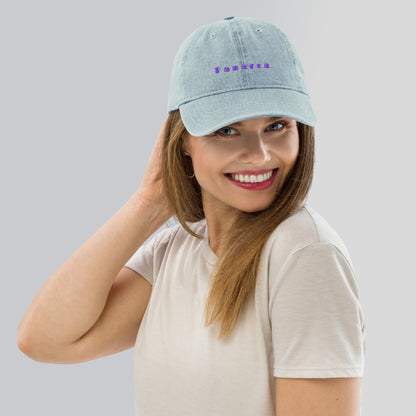 Panarea light denim cap with bold purple text
